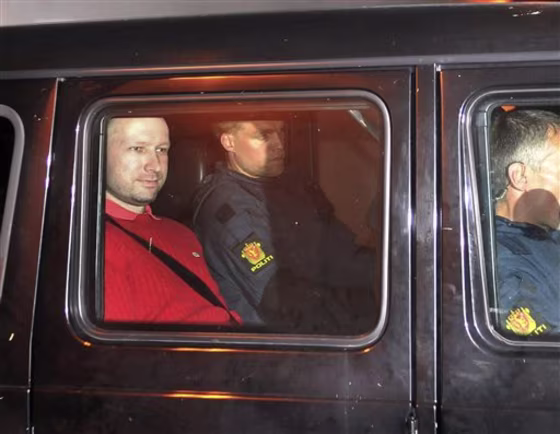 Suspect Anders Behring Breivik, left, sits in an armored police vehicle earlier this week.